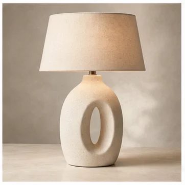 Sculptural ceramic table lamp glowing softly